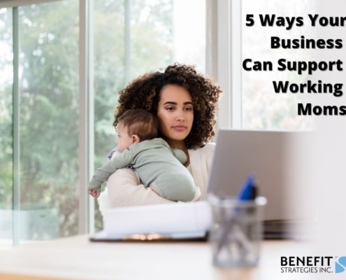Young mom working at home with a baby - supporting working moms